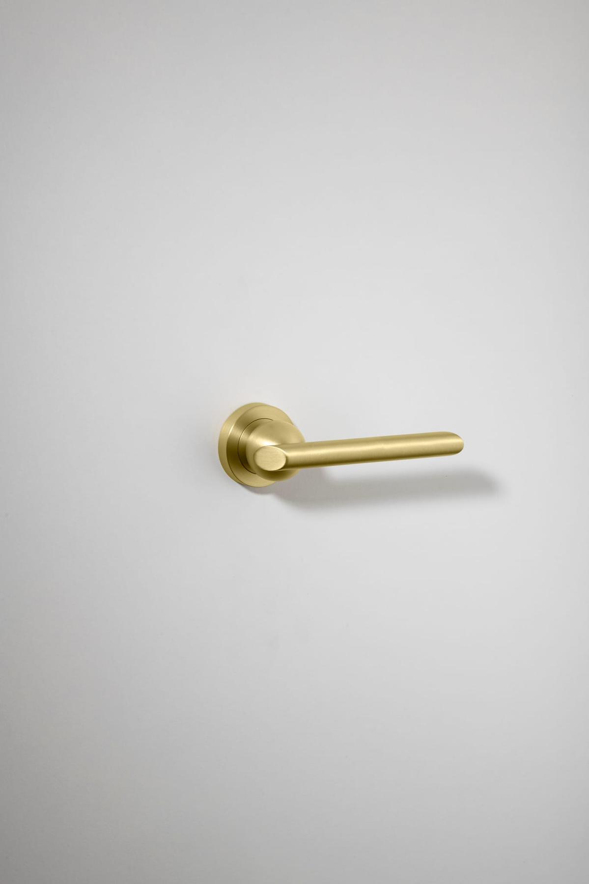 Futurismo Door Lever – Round Rose – Champagne PVD – 20689