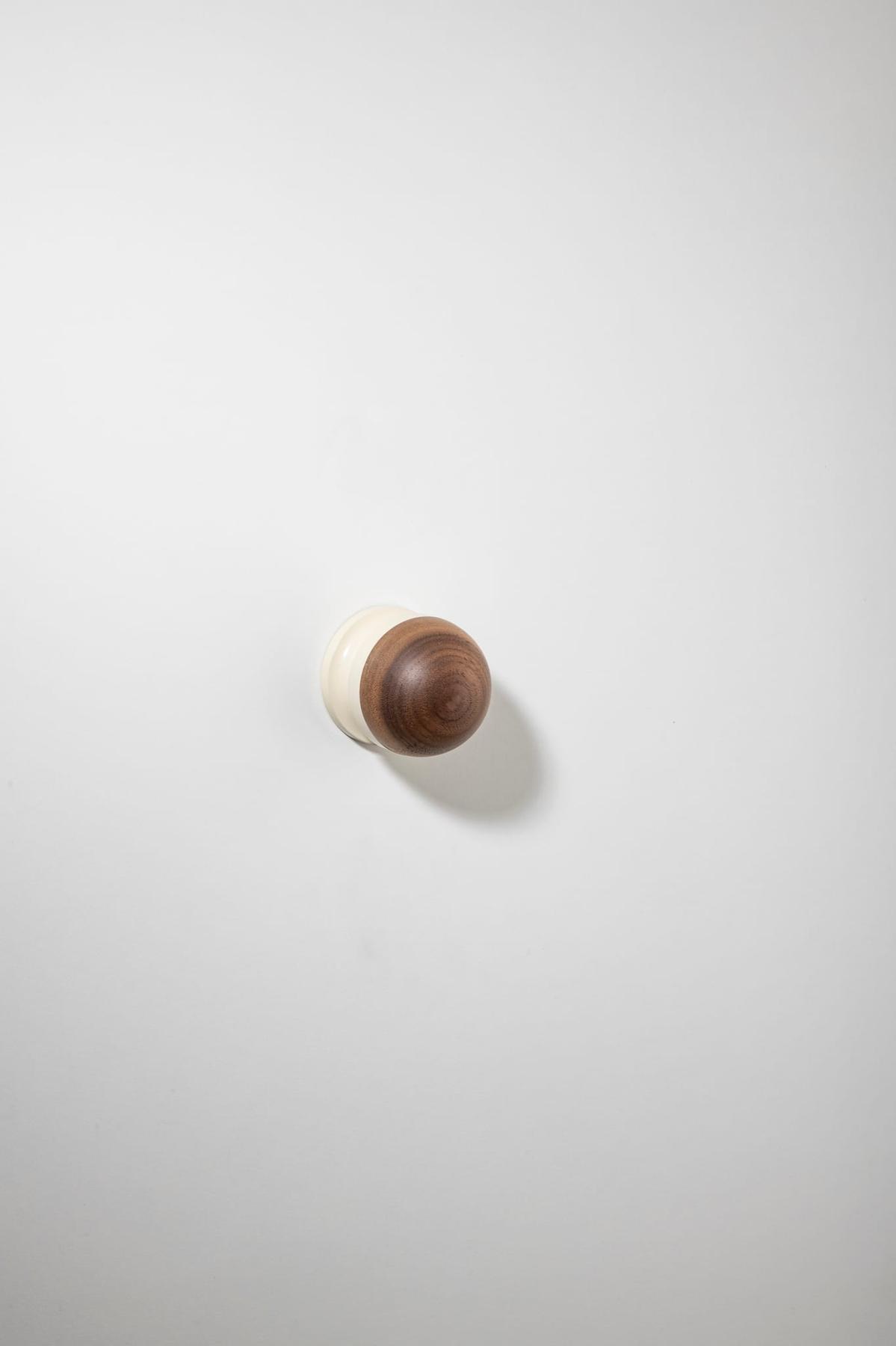 H02 Knob on Rose – Round Rose – American Walnut/Bone – 30205